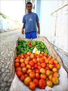 Street vendor displays fruit and vegetables for sale in Trinidad, Cuba