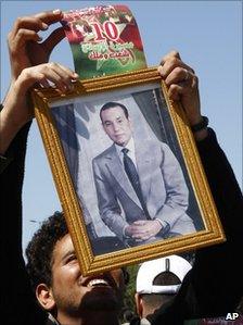 Man holding portrait of King Mohamed VI