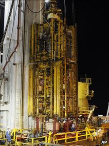 The blowout preventer is lifted onto a ship in the Gulf of Mexico in September