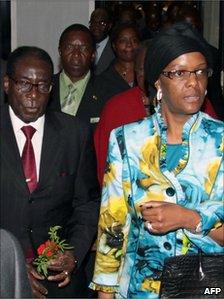 Zimbabwean President Robert Mugabe (left) arrives at Rome's Fiumicino airport with his wife Grace, 30 April