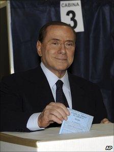 Italian Premier Silvio Berlusconi casts his ballot at a polling station in Milan, Italy, May 29, 2011