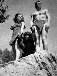 A file photo shows Johnny Weissmuller, right, as Tarzan, Maureen O'Sullivan as Jane, and Cheetah the chimpanzee, in a scene from the 1932 movie Tarzan the Ape Man