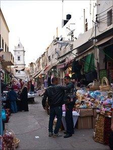 Shop owners at a market in central Tripoli