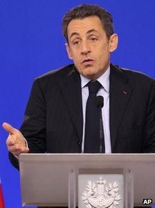 French President Nicolas Sarkozy addresses the media during an EU summit at the European Council building in Brussels, Monday, Jan. 30, 2012