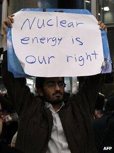Iranian student protests at Tehran airport on 29 January 2012 as inspectors from the UN nuclear watchdog, the International Atomic Energy Agency (IAEA), arrive for talks