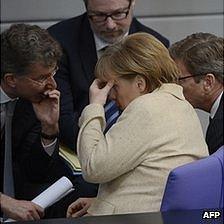 Chancellor Merkel with aides in Bundestag, 10 May 12