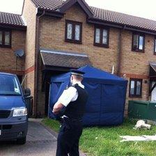 Police officer outside the Stratford house