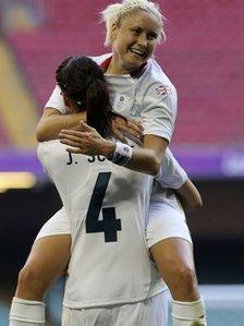 Britain's Stephanie Houghton celebrates with her team mate Casey Stoney after their women's Group E football match against New Zealand at the London 2012 Olympic Games in the Millennium Stadium in Cardiff