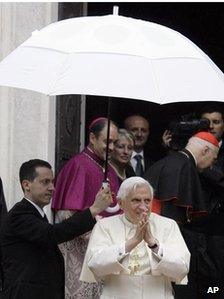 File pic: Paolo Gabriele holds umbrella for Pope Benedict XVI
