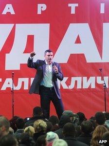 Ukrainian heavyweight boxing superstar Vitali Klitschko gestures during a campaign rally outside Kiev on October 25