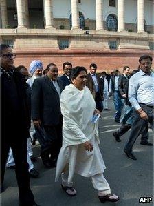 Bahujan Samaj Party (BSP) President Mayawati (C) leaves Parliament house during the winter session in New Delhi on December 5, 2012.