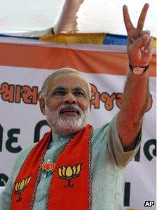 Gujarat state Chief Minister Narendra Modi flashes a victory sign during an election campaign rally for state assembly elections at Prantij in Ahmadabad, India, Saturday, 15 Dec 2012