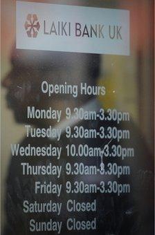 Opening hours advertised at a branch of Laiki Bank