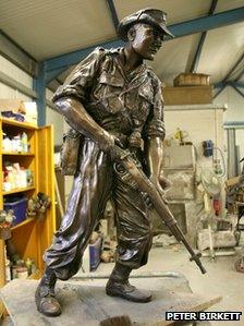 Bronze statue in artist's workshop