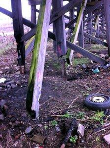 Burnt support pillars leave the staithes hovering in mid air in places