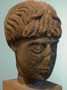 Carved stone head believed to be a Roman god