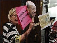 A protester at a Senate hearing on Goldman Sachs