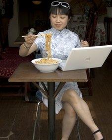 Chinese woman using computer, BBC