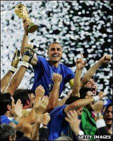 The Italian players celebrate as Fabio Cannavaro of Italy lifts the World Cup trophy aloft following victory in a penalty shootout at the end of the Fifa World Cup Germany 2006 Final