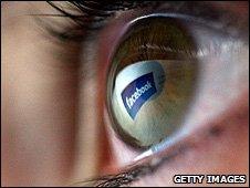 Facebook logo reflected in eye