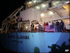 Crew members celebrating on the Maersk Alabama after the captain's release