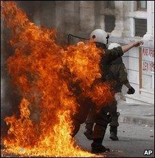 Policeman hit by petrol bomb