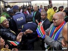 President Jacob Zuma hands out flags ahead of World Cup
