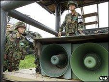 South Korean soldiers stand by loud-speakers at a guard post near the demilitarised zone on 24 May 2010