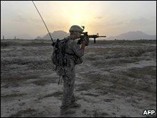 A US soldier on patrol outside Kandahar, 17 May 2010