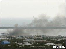 Smoke rises over Kingston's Tivoli Gardens community, 24 May