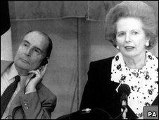 Francois Mitterand listens to a translation of Margaret Thatcher in 1990