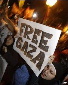 A woman holds a 'Free Gaza' banner in Sydney, Australia