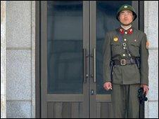 A North Korean soldier stands guard in the truce village on Panmunjom in the demilitarised zone on 2 June 2010