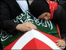 A widow of one of the activists mourns by his coffin at Fatih Mosque in Istanbul on 3/6/2010