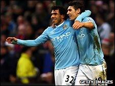 Carlos Tevez and Gareth Barry of Manchester City