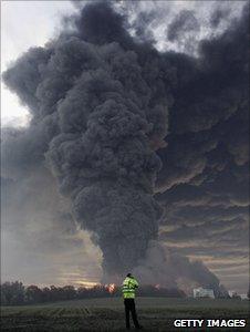 Man looks at cloud coming from Buncefield fire