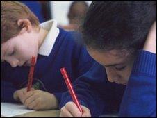 Junior school pupils writing
