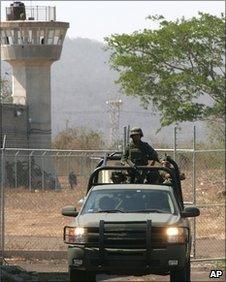 Mexican army soldiers patrol outside the Mazatlan prison, Mexico, 14 June 2010