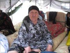 Elderly woman in refugee camp