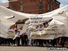Torn banner depicting the original Widgery report into Bloody Sunday