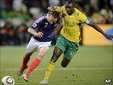 France's Franck Ribery, left, and South Africa's Aaron Mokoena jostle for the ball - 22 June 2010