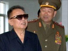 North Korean leader Kim Jong-il (left) in undated photo released by KCNA