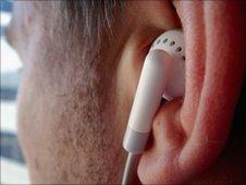Man listening to music on earphones