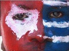 West Papuan protester's face, painted as the banned separatist flag, 8 July 2010