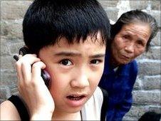A Chinese boy makes a mobile phone call