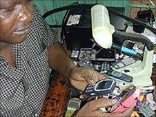 A man repairing mobile handsets