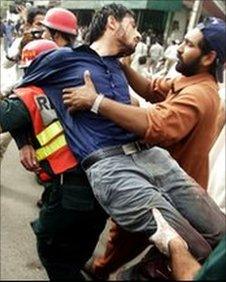 An injured man during an attack on an Ahmadi mosque in May 2010