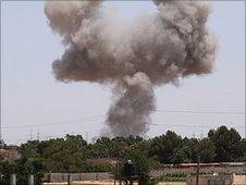 Smoke billows from a spot targeted by a NATO air strike on July 1, 2011 in the Tripoli suburb of Tajura,