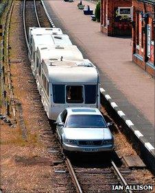 Car pulls caravan at Great Central Railway