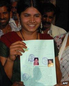 Laxmi Sargara holds up the document that annuls her child marriage
